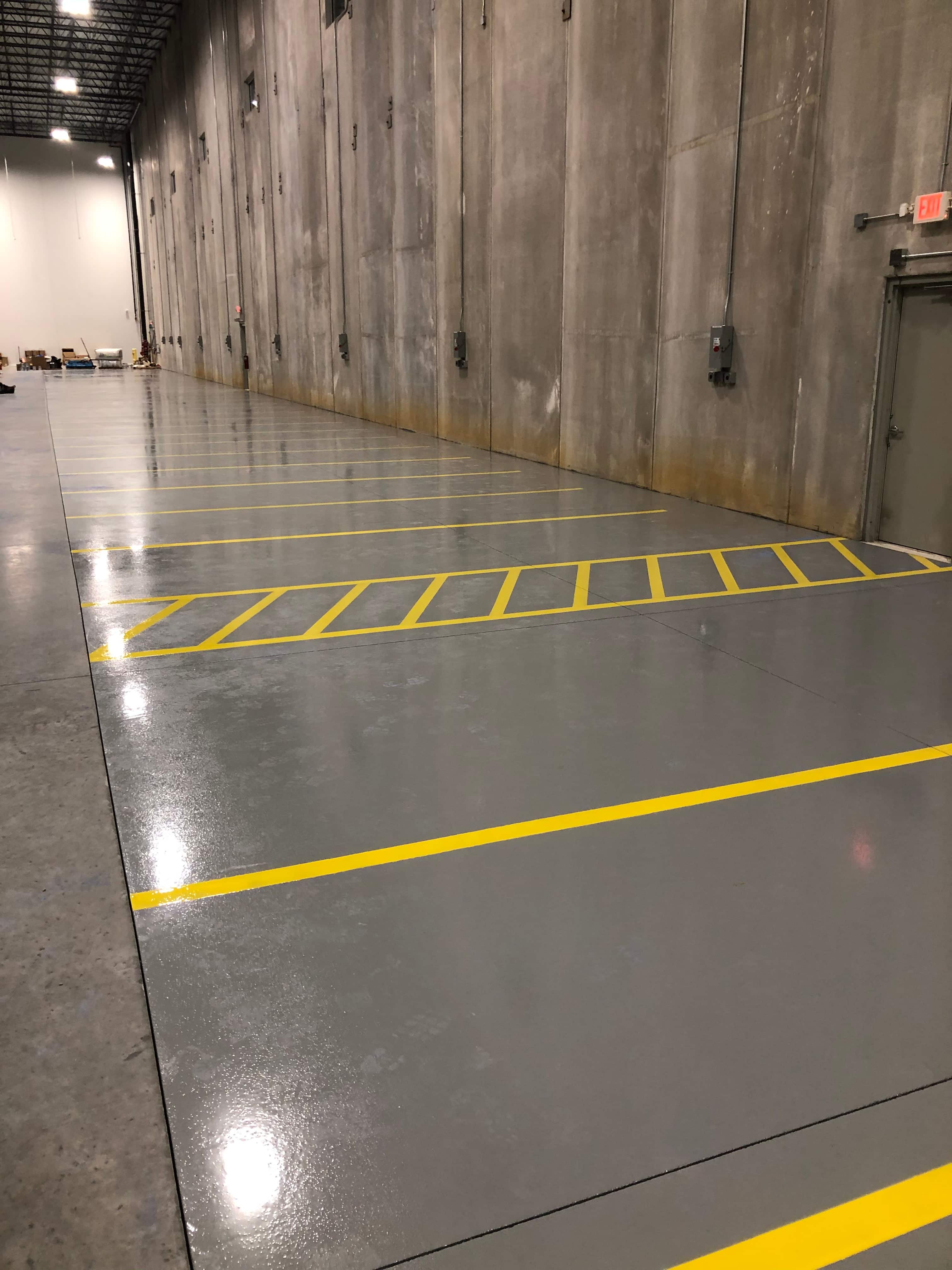 High-build epoxy flooring system for warehouse traffic lanes